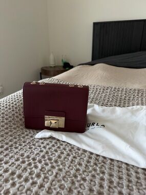 Furla Small Crossbody Bag in Deep Burgundy with Gold Hardware